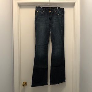 7 for all Mankind low rise flares jeans in dark wash. Size 28
